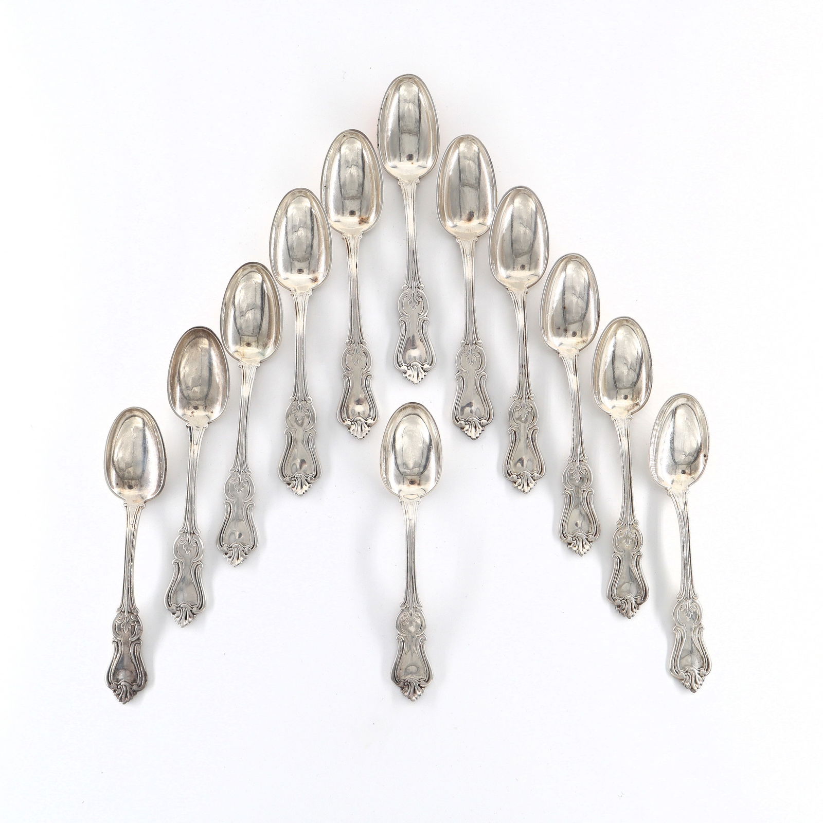12 Gorham & Thurber Coin Silver Teaspoons: A set of twelve mid 19th century American Coin Silver teaspoons by Gorham and Thurber, c. 1850. Impressed "Gorham & Thurber" and "Pure Coin". 14.97 troy ozs total. Slight surface wear, monogrammed ver