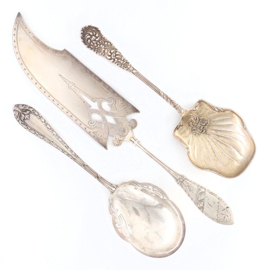 3 American Sterling Serving Utensils: Three turn of the century American Sterling Silver serving utensils. Includes a Dominick & Haff "Marie Antionette" pattern berry spoon, an M. W. Beveridge berry spoon, and a Meriden fish server. Each