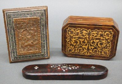 3 Victorian cases: Three turn of the century Victorian cases. Includes a carved card case with inlaid border, a Tortoise Shell comb case with hinged MOP inlaid lid and a small box with finely inlaid foliage. Minor wear.