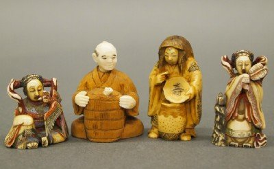 4 Ivory Netsukes: Four 20th century Japanese Carved Ivory Netsukes with inked detail. Depicting various figures, one with a carved wooden body. Incised signatures. Wear and minor damage. Up to 2" high. ESTIMATE $200-30