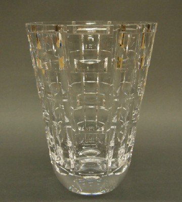 Orrefors vase: A mid 20th century Orrefors Cut Crystal vase. Thick lead crystal with geometric cut design on tapering panels. Etched signature. Slight wear. 10" high. ESTIMATE $100-200