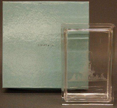 Tiffany Crystal box: A 20th century Tiffany & Co Crystal covered box. Etched design with the Fountain at Tuileries. Acid etched signature. Slight wear. Includes Blue Tiffany gift box. 6" long. ESTIMATE $100-150