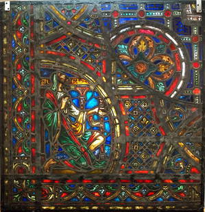 Gothic Revival Stained Glass Panel of Joel: A Gothic Revival Stained Glass panel of the Prophet Joel. Multi-color stained and leaded glass panels with reverse painted detail depicting Joel on his knees within geometric and foliate borders. Seve