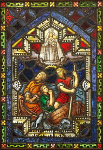 Gothic Revival Stained Glass Window Our Lady of Charity: A Gothic Revival Stained Glass window of Our Lady of Charity. Multi-color stained and leaded glass panels with reverse painted detail depicting imperiled Sailors praying to the Holy Mother and Child