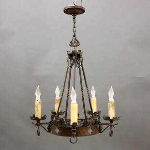 Gothic Revival Chandelier: An early 20th century Gothic Revival Period chandelier. Five light design with patinated Brass body and pierced Cross detail. Some wear to finish and "candles". Approx. 20" diameter x 24" high overall