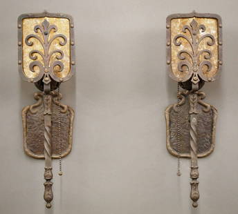 Pr Gothic Revival Sconces: A pair of early 20th century Gothic Revival Period sconces. Cast Brass bodies with single lights and Shield design with foliate details, patinated finish and Mica liners. Some wear to finish and pitti