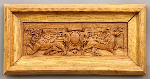 Gothic Revival Carved Panel: A 19th century Gothic Revival Period carved Oak panel. Carved frieze with central shield flanked by a winged lion and bull. Older finish with minor wear. Panel 20 x 6 1/2" high, in a Oak frame with mi