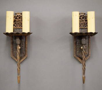 Pr Gothic Revival Sconces: A pair of early 20th century Gothic Revival Period sconces. Cast Iron bodies with British Coat of Arms design, two lights and patinated finish. Minor wear to finish. Each 14" high. ESTIMATE $200-400