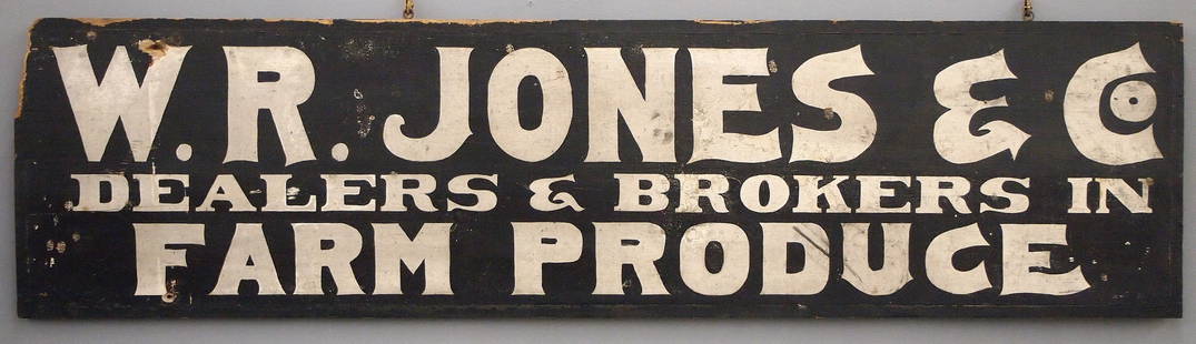 Wooden Trade Sign: A turn of the century wooden Trade Sign advertising "W. R. Jones & Co., Dealers & Producers in Farm Produce". Double sided painted wooden sign with Black lettering on a White background. Some surface