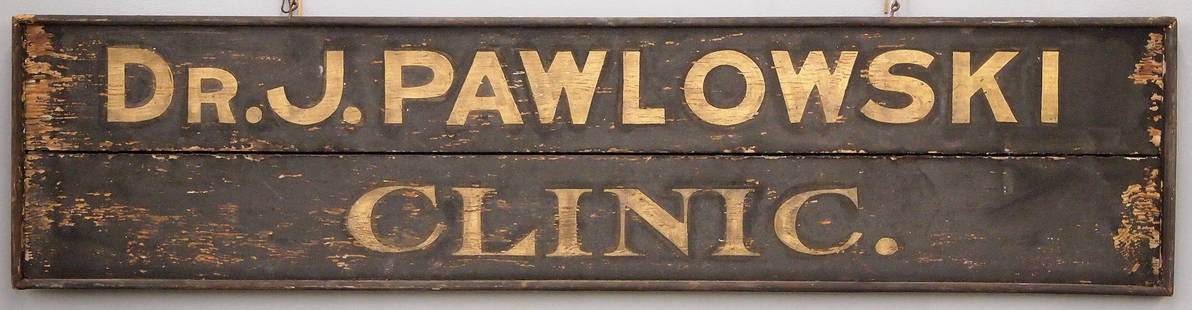 Wooden Trade Sign: A turn of the century wooden Trade Sign advertising "Dr. J. Pawlowski, Clinic". Single sided painted wooden sign with Gold lettering on a Black schmaltz background. Some surface wear, some paint loss.