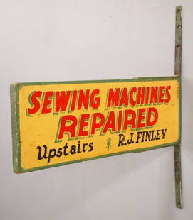 Wooden Trade Sign: A turn of the century wooden Trade Sign advertising "Sewing Machines Repaired, Upstairs - R. J. Finley". Double sided painted wooden sign with iron brackets. Some surface wear. 20 1/2" long x 7 1/4" h