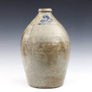 North Carolina Stoneware Jug: A 19th century American Stoneware jug from Catawba Valley, North Carolina. Bulbous form with strap handle and salt glazed exterior and Cobalt Blue painted "2" gallon. Labeled "Souvenir of Loarn" at un