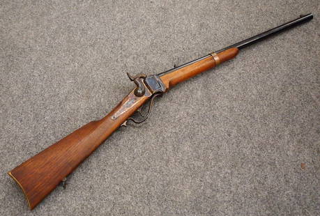 Replica Robinson 1862 Sharps Carbine: A replica of an S.C. Robinson 1862 Confederate Sharps Carbine. .54 Caliber with 21" barrel, Walnut stock, Blued Steel trigger guard and Brass butt plate. Marked "S.C. Robinson / Arms Manufactory / Ric