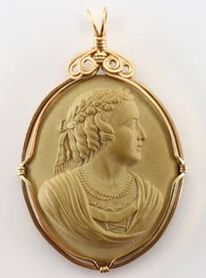 Lava Stone Cameo Pendant: A 19th century Victorian Period Lava Stone cameo pendant. Neoclassical depiction of a woman's profile set in a Gold Filled wire frame. Minor discoloration. 2 1/4" high. ESTIMATE $50-100