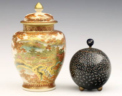 2 Japanese Covered Jars: Two early 20th century Japanese covered jars. Includes a Satsuma porcelain jar with hand-painted Pagoda landscape decoration and Gilded detail, and a small round Cloisonne jar with multi-color Butterf