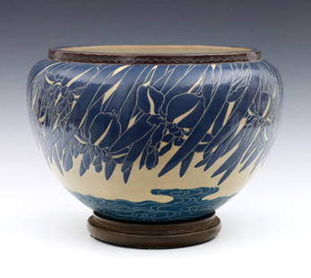 Art Nouveau Pottery Jardiniere: An early 20th century Gustavsberg style Art Nouveau pottery jardiniere. Bulbous form with Blue Iris and Wave sgraffito decoration on an Ivory ground. Hairlines to bottom, crazing. 12" diameter x 8 1/4