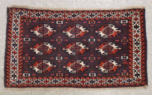 Turkmen Chuval Mat: A 1.9' x 3.3' Turkmen Chuval mat. Multi-color geometric tribal design within multiple borders on Plum field. Some wear and minor fading, losses to edges and fringe, repair to one corner. ESTIMATE $100