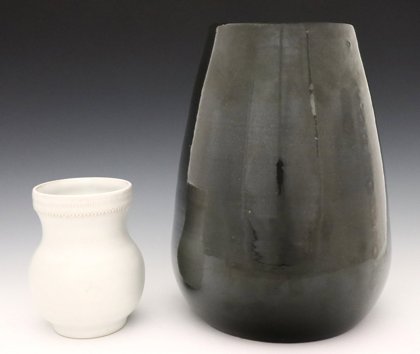 2 Denver White Art Pottery Vases: Two early 20th century Denver White Art Pottery vases. Includes a larger vase with "elephant foot" form and Gray glaze, and a smaller vase with bulbous form, incised decoration and White matte glaze. 
