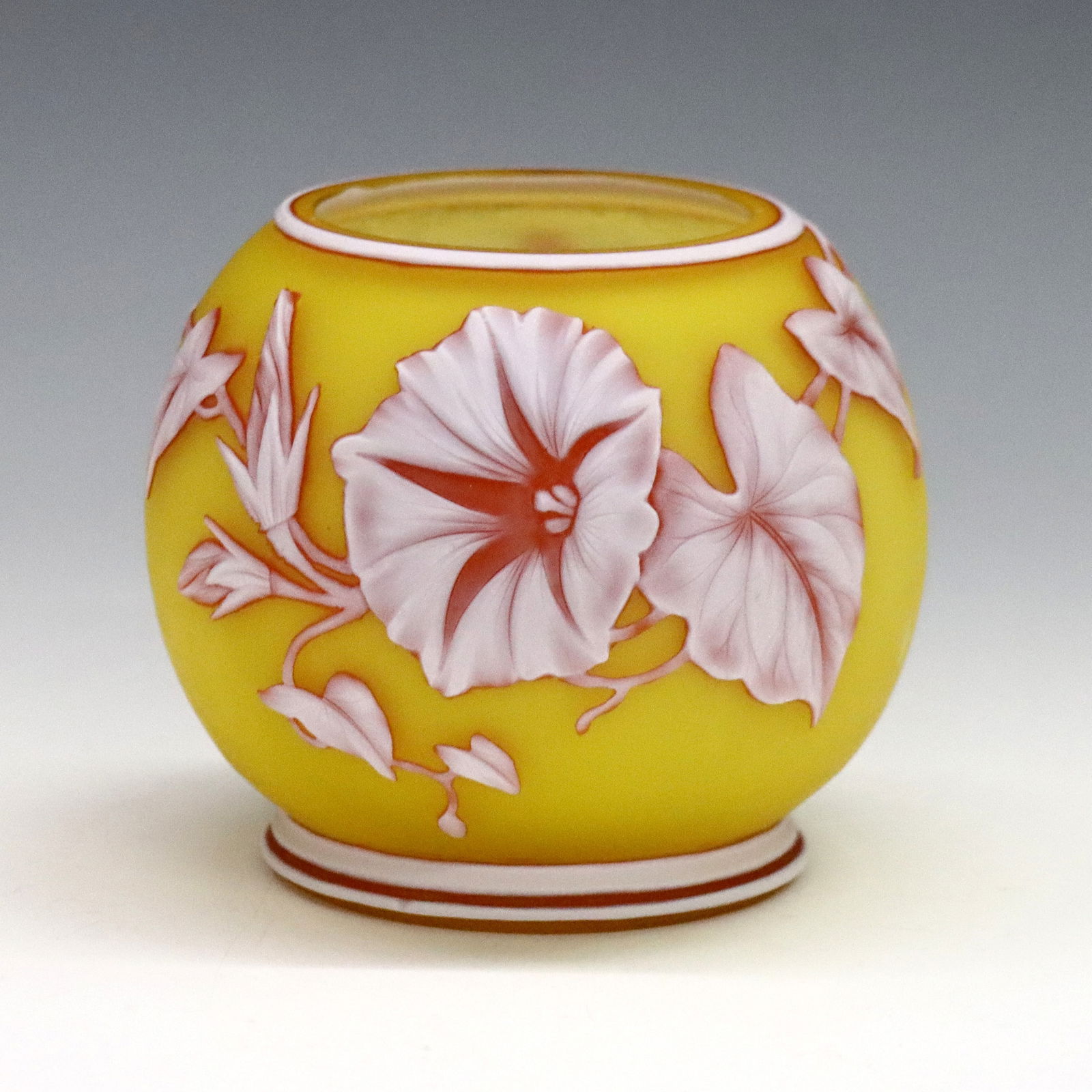 Webb Cameo Glass Vase: A late 19th century Victorian Period Cameo Glass vase attributed to Thomas Webb & Sons. Round form with White and Cranberry floral and butterfly decoration on a Citrine ground. Unsigned. Two small fla