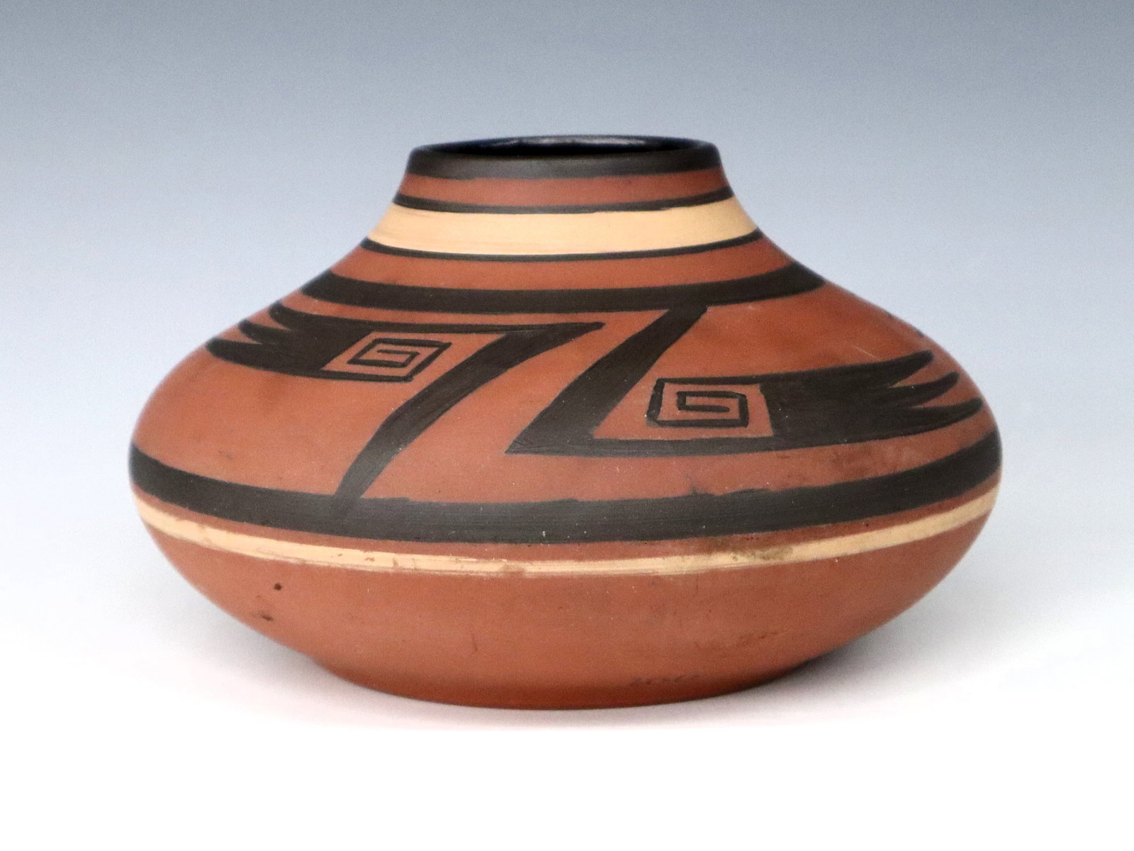 Clifton Four-Mile Ruin Terracotta Jar: An early 20th century Clifton Terracotta jar from Four-Mile Ruin pueblo, Arizona. Bulbous form with Tan and Black hand-painted decoration. Stamped "Four-Mile Ruin, Ariz." and "Clifton" marks with "160