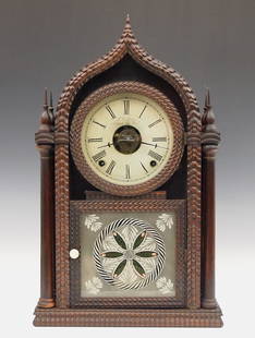 J.C. Brown Ripple Front Sharp Gothic Shelf Clock: A 19th century J. C. Brown ripple front sharp gothic shelf clock. 8-day time, strike and alarm movement with painted metal dial. Rosewood case with applied ripple moldings features a sharp gothic