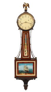 Waltham Banjo Clock: A 1930's Waltham banjo wall clock. 8-day weight driven time only movement with maintaining power and Geneva stops, painted metal dial and Arabic numerals, marked "Waltham" on dial. Mahogany case