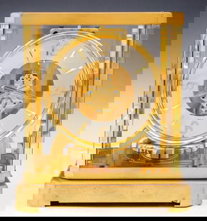 Jaeger LeCoultre For Gubelin Atmos Perpetual Clock: A mid 20th century Jaeger LeCoultre Caliber 528-8 Atmos clock made for Gubelin. Perpetual movement runs on atmospheric pressure, Silvered chapter ring with Arabic numerals and Arrow markers marked "Gu