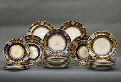 Ashworth's dinner service: A 19th century Ashworth's Ironstone dinner service. Cobalt rims with floral reserves and Gilded detail. Printed and impressed marks. Includes 4 x 10 1/2" plates, 8 x 9 1/2" soups, 12 x 9 1/2" plates a