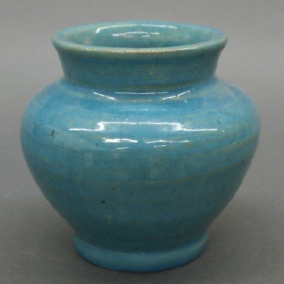 Pewabic Pottery vase: A turn of the century Pewabic Pottery vase. Squat baluster form in a Turquoise Metallic glaze. Circular impressed mark. Minor wear. 4 3/4" high. ESTIMATE $200-300