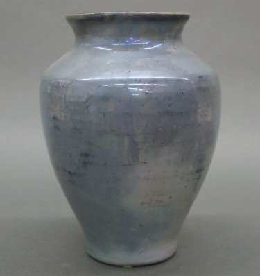 Pewabic Pottery vase: A turn of the century Pewabic Pottery vase. Baluster form with flared rim in a Blue Metallic glaze. Circular impressed mark. Some surface wear. 8 1/2" high. ESTIMATE $600-800