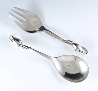 G. Jensen Blossom Sterling Salad Serving Set: An early to mid 20th century Georg Jensen "Blossom" Sterling Silver salad serving set. Includes a hand-hammered serving fork and spoon with Art Nouveau floral design. Impressed maker's marks with