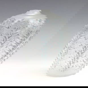 R. Lalique Tournai Glass Vase: An early 20th century Rene Lalique "Tournai" pattern glass vase. Tapered form with high shoulder and frosted cut to clear foliate design. Marked "R. Lalique" at underside. Minor surface wear,