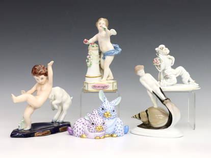 5 Continental Porcelain Figures: Five early 20th century Continental porcelain figurines. Includes a Herend Fishnet bunny grouping, a Meissen "Un Me Suffit" cherub figure, a Caasmann for Rosenthal "Snail Ride" figure, a