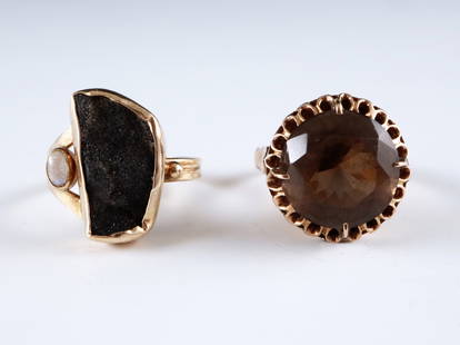 2 14K Gold Cocktail & Modernist Rings: Two 14k Gold rings. Includes a cocktail ring with round cut Smokey Quartz stone, and a Modernist ring with rough Hematite and Opal stones. Both marked 14k, Modernist ring also signed "Gilded Forest