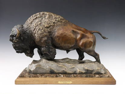 J. Gilmore Bronze Bison: Jim Gilmore, American, b. 1950. A late 20th century Bronze Bison figure, titled "Yellowstone Winter". Depicts a lone Bison trudging through snow. Presented on a molded Walnut base with inset