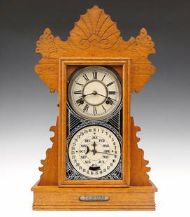 Feishtinger Calendar Shelf Clock: A late 19th century Charles W. Feishtinger Calendar shelf clock. 8-day time and strike movement with lower calendar mechanism indicating date and month and a day of the week roller below, painted