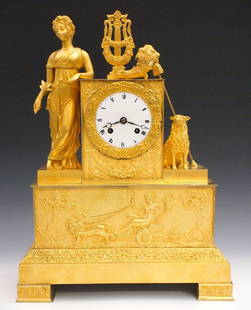 French Empire Bronze Mantel Clock: An early 19th century Empire Period gilded Bronze mantel clock. 8-day time and strike movement with silk thread suspension, convex porcelain dial and Roman numerals. Finely chased Bronze case