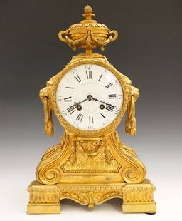 French Bronze Mantel Clock: A 19th century French Bronze mantel clock. 8-day time and strike movement with convex porcelain dial and Roman/Arabic numerals marked "Lassaille et Cie, _Boult des Capucines Paris_", movement marked