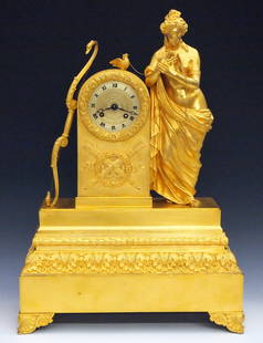 French Empire Gilded Bronze Mantel Clock: An early 19th century Empire Period gilded Bronze mantel clock by Douyon, Paris. 8-day time and strike movement with silk thread suspension, Brass dial and applied Roman numerals. Finely chased Bronze