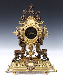 Lenzkirch Bronze Table Clock: A turn of century Lenzkirch Bronze table clock with Bacchanalian motif. 14-day time and strike movement with Cast dial, Red enamel inlay and Roman numerals, filigree hands and original mask pendulum,