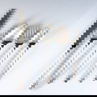 40 pc International Prelude Sterling Flatware: Forty pieces of International "Prelude" pattern Sterling Silver flatware. Features 8 five-piece place settings. Includes 8 x 9 1/4" hollow handle dinner knives, 8 x 7 1/4" dinner forks, 8 x 6 1/2"