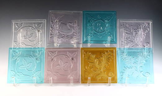 8 Pressed Glass Window Panes: Eight turn of the century American pressed glass window panes attributed to the Mosaic Glass Company, Fostoria, OH. Various floral and swan designs in Aqua, Amethyst, Amber and clear. Some with minor
