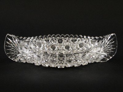 Cut Glass bowl: A 20th century Cut Glass bowl. Canoe shaped, Russian pattern. Slight edge roughness. 11 1/2" long. ESTIMATE $50-100