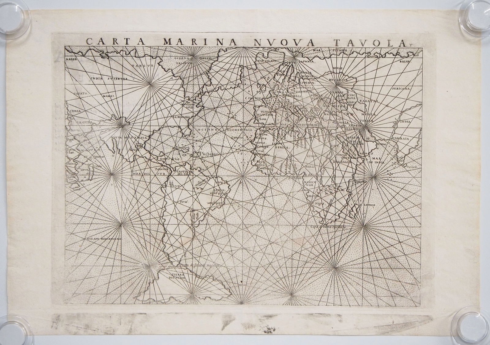 1574 Map By G. Ruscelli: A 16th century map entitled "Carta Marina Nuova Tavola" by Girolamo Ruscelli, 1574. Uncolored engraving on paper. A World map with both hemispheres. Unframed, toning, small filled repairs along the ed