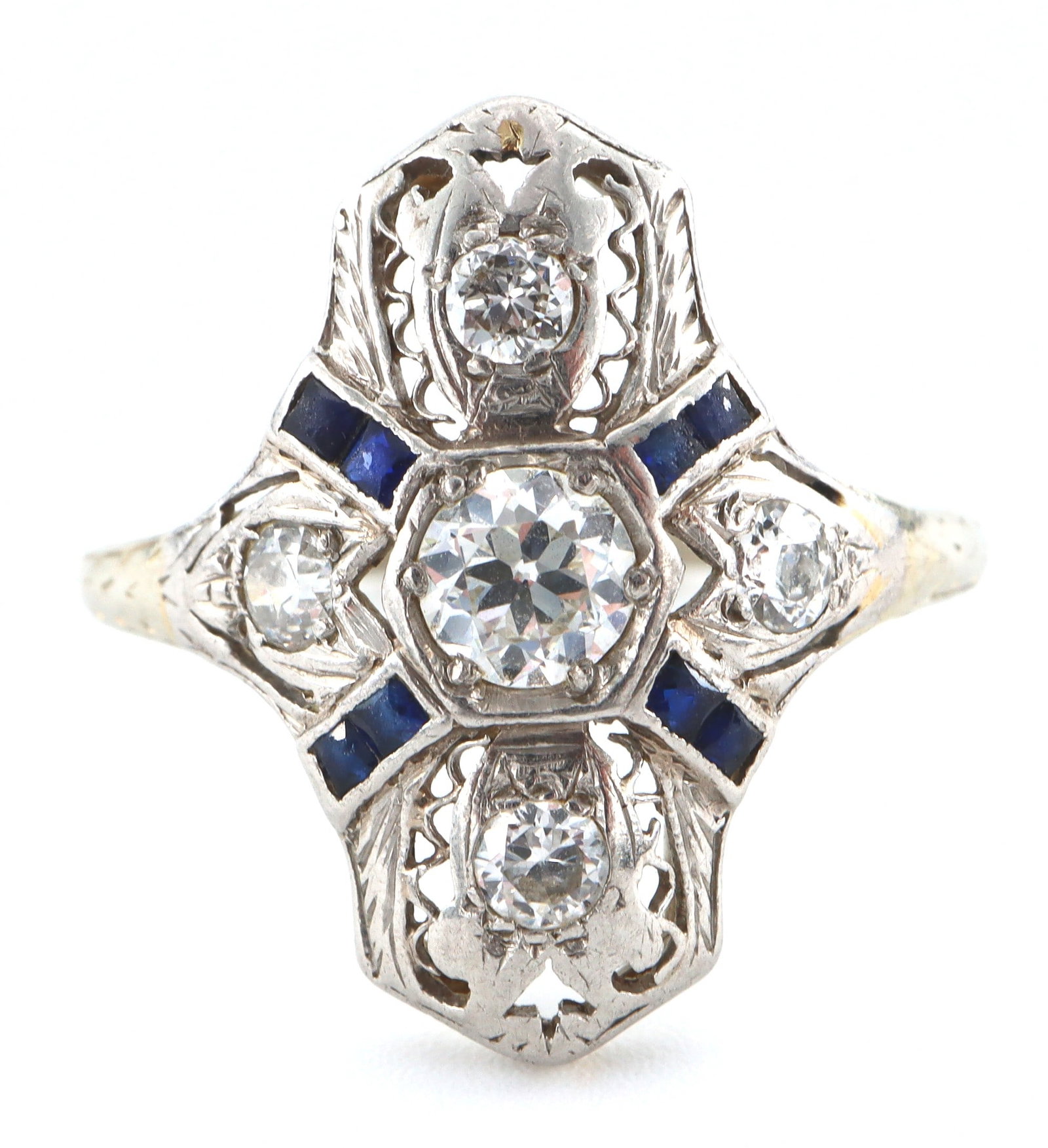 Art Deco 18k Gold, Diamond & Sapphire Ring: An Art Deco 18k White Gold, Diamond and Sapphire ring. Features a round cut prong set Diamond approx. 5 mm and estimated 0.5 ct, on a filigree setting surrounded by Sapphire and Diamond accents. Worn 