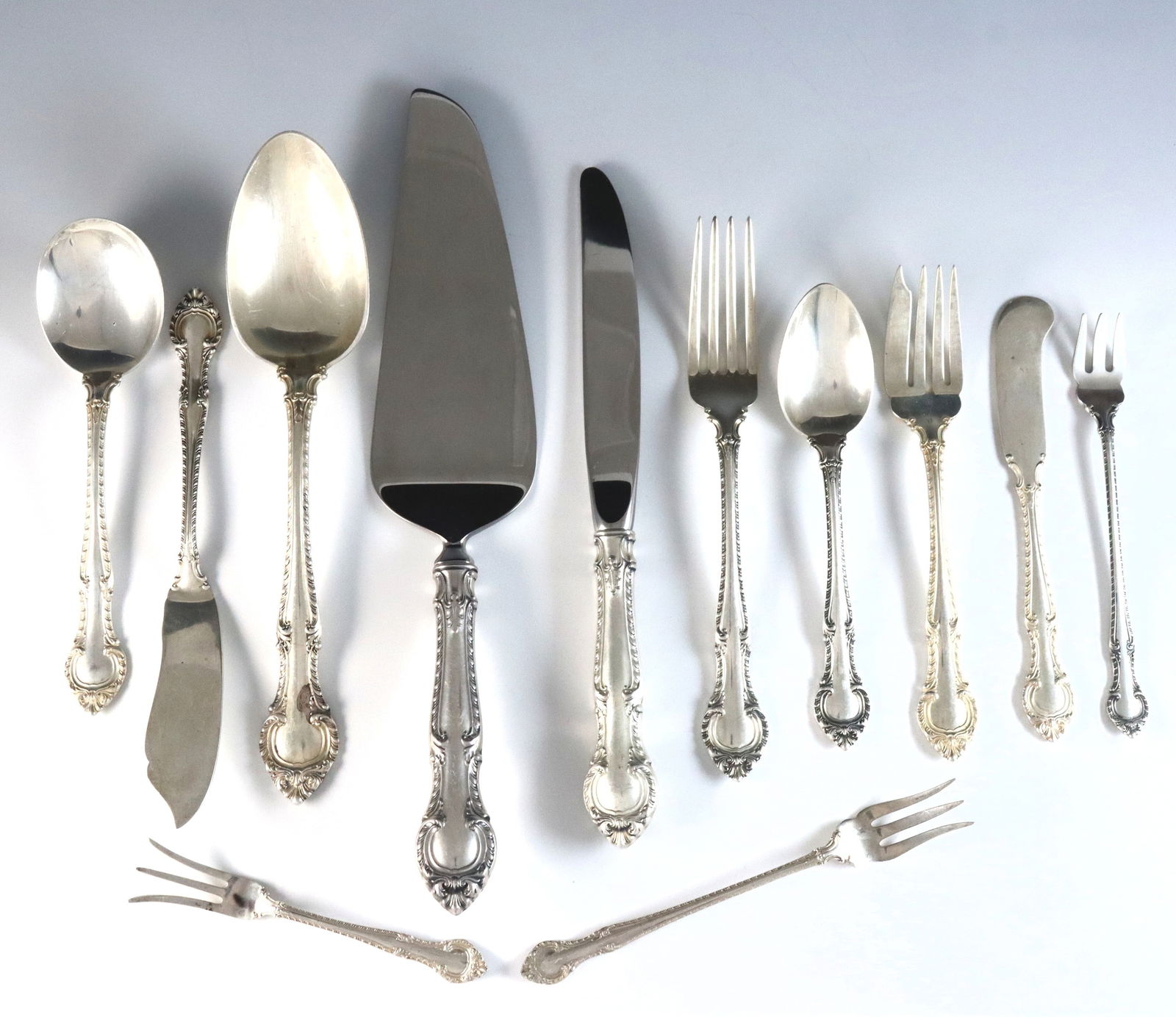 104 pc Gorham English Gadroon Sterling Flatware: One hundred and four pieces of Gorham "English Gadroon" pattern Sterling Silver flatware. Features 11 six-piece place settings plus additional flatware. Includes 11 x 8 3/4" hollow handle dinner knive