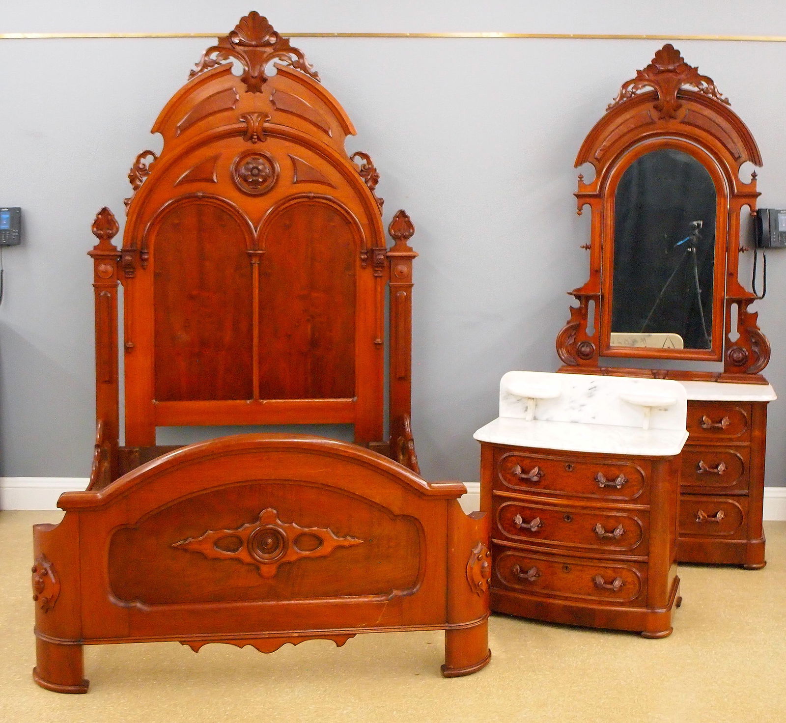 3 pc Victorian Bedroom Set: A 19th century Victorian Renaissance Revival Period three piece bedroom set. Walnut construction with applied Burl panels and carved detail with White molded marble tops. Includes a high back bed (64