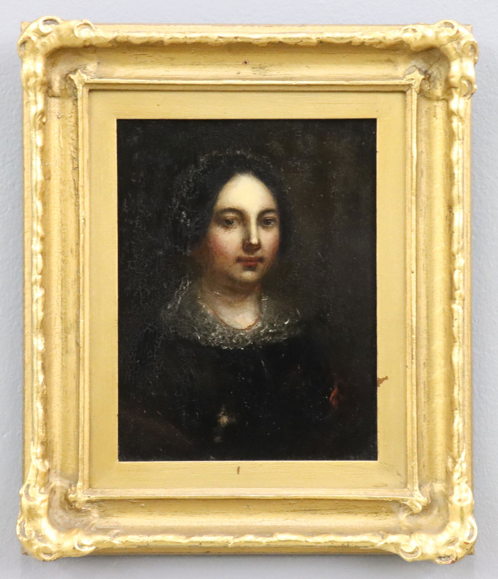 Portrait of a Woman: A 19th century oil on panel portrait of a woman. Depicted quarter length wearing a Black dress with lace collar and cap. Unsigned. Cleaned and revarnished, some craquelure. Image 6 1/4 x 8 1/4" high,
