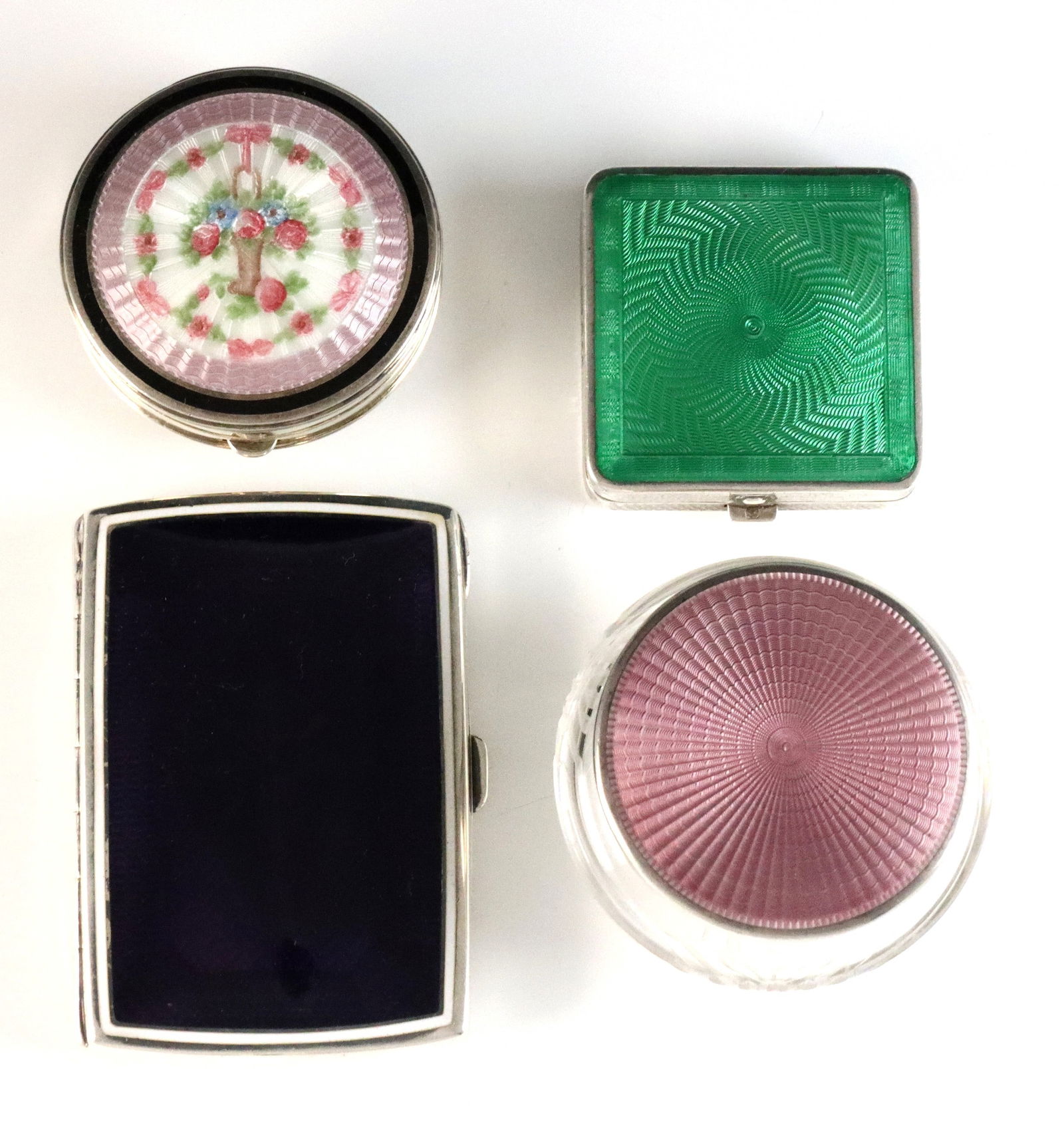 4 Silver Guilloche Cases: Four early 20th century Silver cases with Guilloche enamel decoration. Includes a Purple German .900 Silver cigarette case by Louis Kuppenheim, a Green English Sterling compact by Cohen & Charles, a f