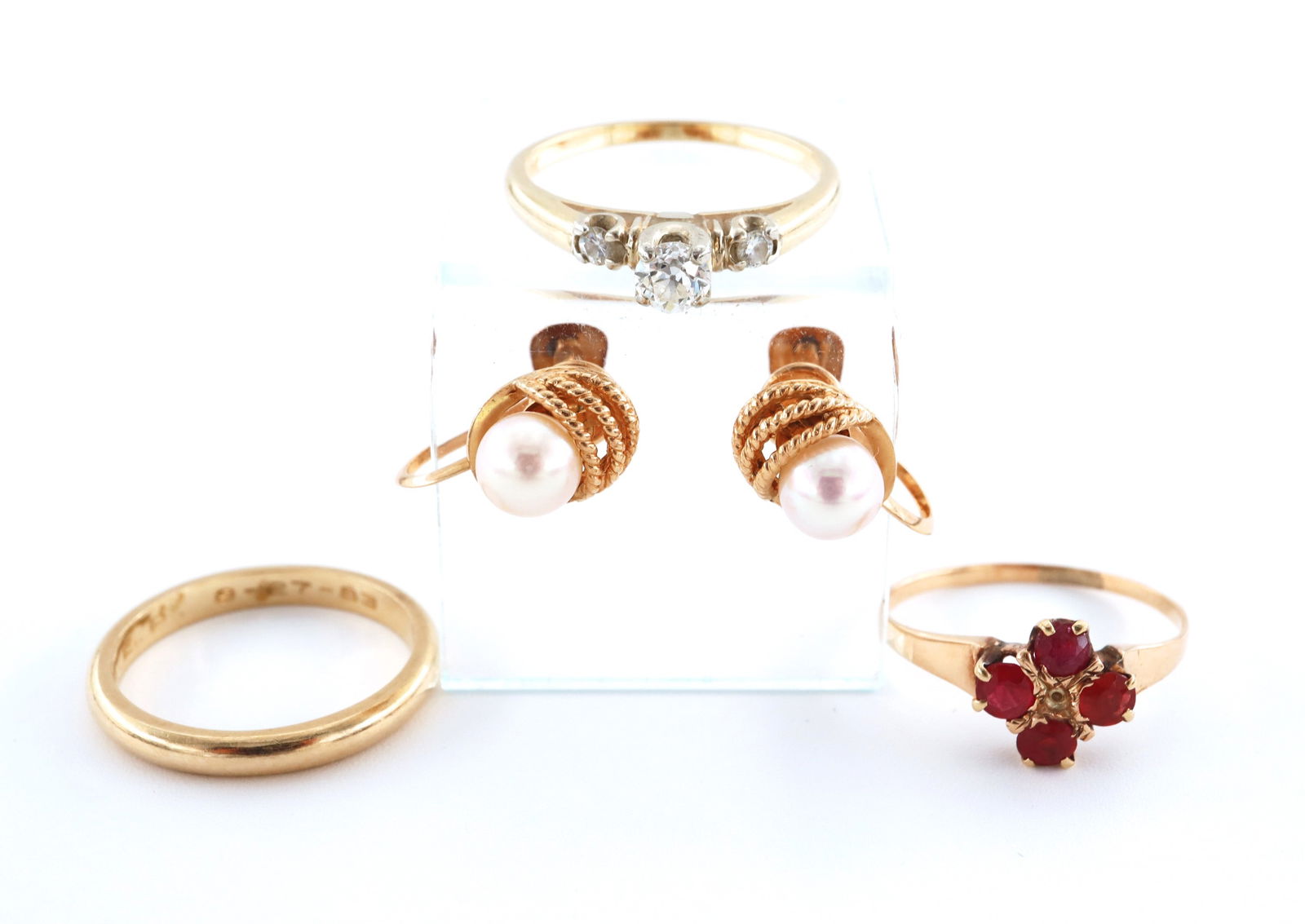 4 pc 14k/10k Gold Jewelry: Four pieces of 14k/10k Gold jewelry. Includes a 14k engagement ring with round cut prong set Diamond flanked by two Diamond accents (size 6 1/4), a 14k wedding band (size 6), a 10k ring with four pron